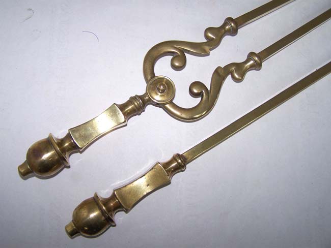 A Pair of early 19th century Brass Fire place tools including a poker and tongs
